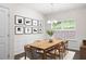 Elegant dining room featuring stylish decor and a decorative light fixture at 131 Prominence Ct, Canton, GA 30114