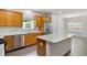 View of the kitchen showcasing its granite countertops, stainless steel appliances, and wooden cabinets at 131 Prominence Ct, Canton, GA 30114