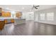 Open-concept living space with kitchen, dining area, and wood-look flooring at 131 Prominence Ct, Canton, GA 30114