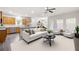 Bright, open-concept living area seamlessly connects the kitchen and dining spaces at 131 Prominence Ct, Canton, GA 30114