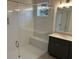 Elegant bathroom with tiled shower, seat, glass door, and modern vanity at 204 Saratoga Dr, Acworth, GA 30102