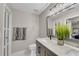 Well-lit bathroom with modern fixtures and marble counters at 208 Magnolia Leaf Dr, Woodstock, GA 30188