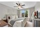 Sunlit primary bedroom with elegant decor and a beautiful view at 208 Magnolia Leaf Dr, Woodstock, GA 30188