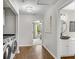 Hallway area with a laundry room, and a doorway leading to the main bedroom and bathroom at 208 Magnolia Leaf Dr, Woodstock, GA 30188