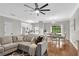 Open concept living area flowing into the kitchen, featuring hardwood floors at 208 Magnolia Leaf Dr, Woodstock, GA 30188