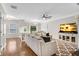Open-concept living room with hardwood floors and plenty of natural light at 208 Magnolia Leaf Dr, Woodstock, GA 30188