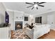 Comfortable living room featuring a fireplace, stylish rug, and hardwood flooring at 208 Magnolia Leaf Dr, Woodstock, GA 30188