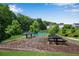 Picnic area in a community, including two picnic tables and two barbecue grills at 208 Magnolia Leaf Dr, Woodstock, GA 30188