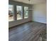 Bright dining area with hardwood flooring and plenty of natural light from the large windows at 208 Saratoga Dr, Acworth, GA 30102