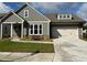 Charming one-story home featuring a two-car garage, landscaped front yard, and neutral exterior paint at 208 Saratoga Dr, Acworth, GA 30102