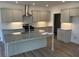 Modern kitchen features granite countertops, gray cabinets, and stainless steel appliances at 208 Saratoga Dr, Acworth, GA 30102