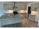 This spacious kitchen features granite countertops, stainless steel appliances, and gray cabinets at 208 Saratoga Dr, Acworth, GA 30102