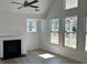 Bright living room with hardwood floors, fireplace, and large windows for natural light at 208 Saratoga Dr, Acworth, GA 30102