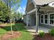 Covered patio with a ceiling fan overlooks the lush green yard, providing an ideal spot for relaxing outdoors at 208 Saratoga Dr, Acworth, GA 30102