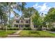 Charming two-story home featuring a stone facade, covered porch, and lush landscaping at 2217 Virginia Ne Pl, Atlanta, GA 30305