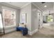 Bright hallway nook featuring window, blue bench, and light grey walls at 2217 Virginia Ne Pl, Atlanta, GA 30305