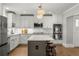 A sleek kitchen with stainless steel appliances, white cabinets, and a central island with seating at 2217 Virginia Ne Pl, Atlanta, GA 30305