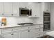 A modern kitchen with granite counters, subway tile backsplash, and stainless steel appliances at 2217 Virginia Ne Pl, Atlanta, GA 30305