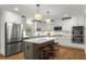 A modern kitchen with granite countertops, stainless steel appliances, and a center island at 2217 Virginia Ne Pl, Atlanta, GA 30305