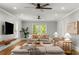 A bright living room featuring hardwood floors, neutral-toned furniture, and recessed lighting at 2217 Virginia Ne Pl, Atlanta, GA 30305