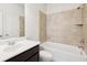 Clean bathroom featuring a shower over tub combination and a modern single sink vanity at 2450 Overlook Ave, Lithonia, GA 30058