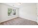Bedroom featuring a window and carpet flooring at 2450 Overlook Ave, Lithonia, GA 30058
