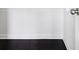Minimalist closet interior featuring dark floors and white shelving at 2450 Overlook Ave, Lithonia, GA 30058