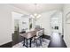 Bright dining area boasts modern decor, dark hardwood floors, and ample natural light, ideal for Gathering meals at 2450 Overlook Ave, Lithonia, GA 30058