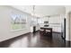 Well-lit kitchen with white cabinets, a center island, and stainless steel appliances, offering a modern and functional space at 2450 Overlook Ave, Lithonia, GA 30058