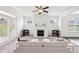 Spacious living room featuring a fireplace, comfortable seating, and ample natural light at 2450 Overlook Ave, Lithonia, GA 30058