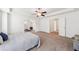 Spacious main bedroom with tray ceilings, ceiling fan, and an attached bonus room at 2450 Overlook Ave, Lithonia, GA 30058