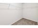Walk-in closet with carpet flooring and wire shelving at 2450 Overlook Ave, Lithonia, GA 30058