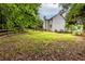 Spacious backyard with lush trees at 1130 Timbercreek Ct, Alpharetta, GA 30005