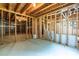Spacious unfinished basement with exposed framing and concrete floors at 1130 Timbercreek Ct, Alpharetta, GA 30005