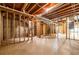 Spacious unfinished basement with exposed framing and concrete floors at 1130 Timbercreek Ct, Alpharetta, GA 30005