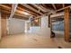 Unfinished basement with concrete flooring and exposed ceiling, ready for future build out at 1130 Timbercreek Ct, Alpharetta, GA 30005