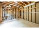 Unfinished basement with exposed framing and utilities, offering potential for customization at 1130 Timbercreek Ct, Alpharetta, GA 30005
