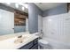 Bathroom featuring white tile, new fixtures, and modern farmhouse accents at 1130 Timbercreek Ct, Alpharetta, GA 30005