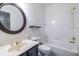 Bathroom with white tile, a toilet, sink, mirror and tub shower at 1130 Timbercreek Ct, Alpharetta, GA 30005