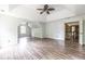 A bedroom with gray walls, two windows, vaulted ceiling, and wood-look flooring at 1130 Timbercreek Ct, Alpharetta, GA 30005