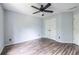 Bedroom with wood floors, ceiling fan and double door closet at 1130 Timbercreek Ct, Alpharetta, GA 30005