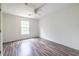Bedroom with wood floors and neutral paint provides a blank canvas at 1130 Timbercreek Ct, Alpharetta, GA 30005