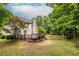 Home exterior, with a spacious backyard and a wooden deck at 1130 Timbercreek Ct, Alpharetta, GA 30005