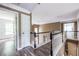 Bright hallway featuring wood floors, white trim, and a view to a room with two windows at 1130 Timbercreek Ct, Alpharetta, GA 30005