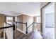 Hallway with railing and multiple doorways at 1130 Timbercreek Ct, Alpharetta, GA 30005