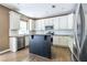Spacious kitchen featuring white cabinets, stainless steel appliances, granite countertops, and a center island at 1130 Timbercreek Ct, Alpharetta, GA 30005