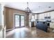 Bright eat-in kitchen featuring white cabinets, stainless steel appliances, granite countertops, and access to the deck at 1130 Timbercreek Ct, Alpharetta, GA 30005
