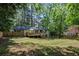 Expansive backyard showcasing a wooden deck and lush greenery, perfect for outdoor gatherings and relaxation at 2238 Pinecliff Ne Dr, Atlanta, GA 30345