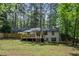 Spacious backyard featuring a large wooden deck, lush greenery, and a privacy fence, perfect for outdoor living at 2238 Pinecliff Ne Dr, Atlanta, GA 30345