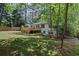 Lush backyard with a spacious wooden deck, complemented by mature trees and a new privacy fence at 2238 Pinecliff Ne Dr, Atlanta, GA 30345